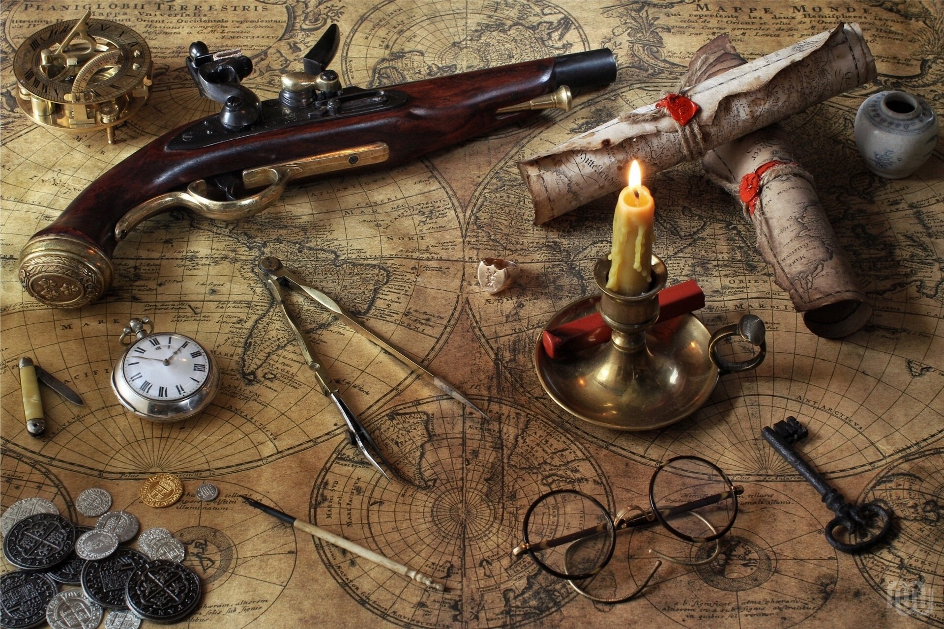 pistol cards candle sunglasses watches compasses key compass coin