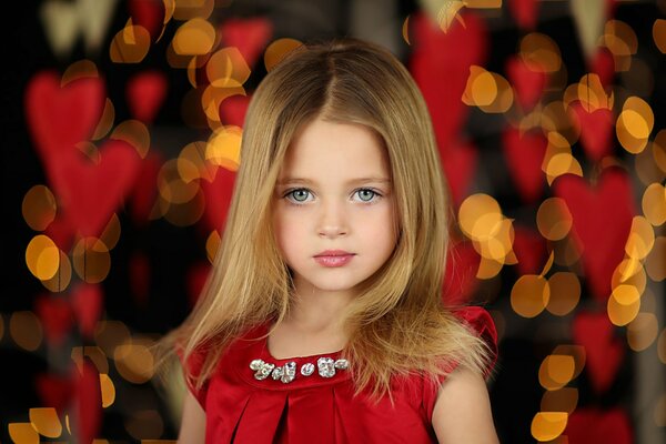 The girl is beautifully made up and dressed