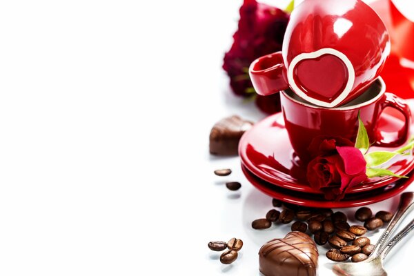 Nature morte avec des tasses, des roses et des bonbons