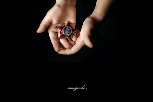 Children s hands hold a military medal