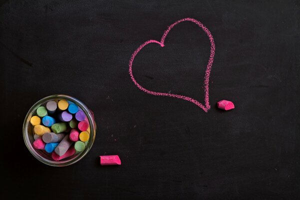 A pink heart drawn in chalk