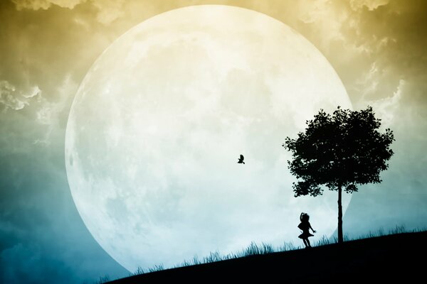 A girl near a tree looks at the silhouette of a bird on the moon