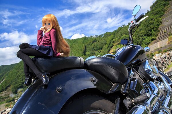 Doll on the seat of a Yamaha motorcycle