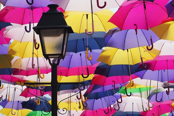 Beautiful street of umbrellas with a lantern