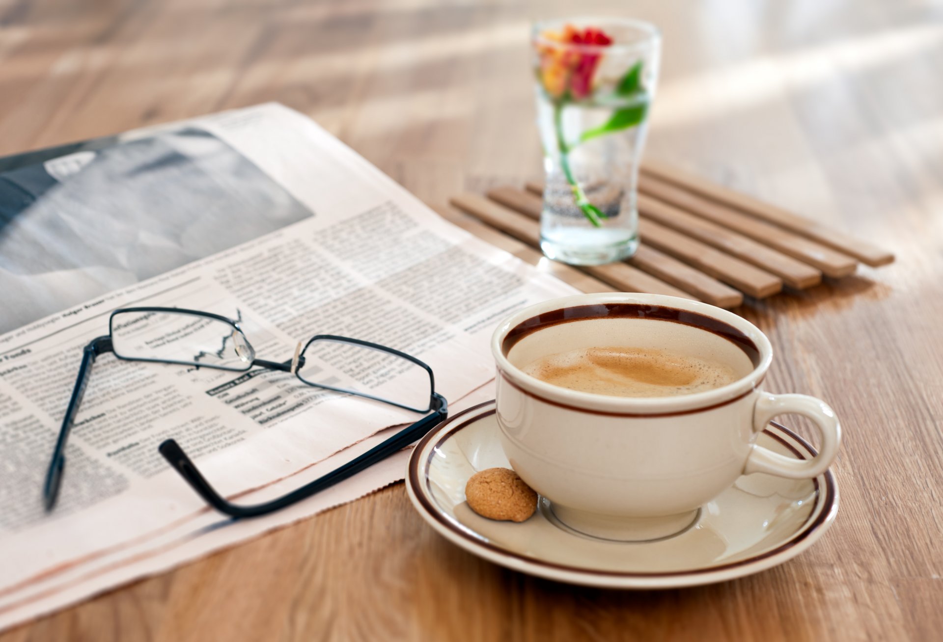 table sunglasses newspapers coffee foam flower gla