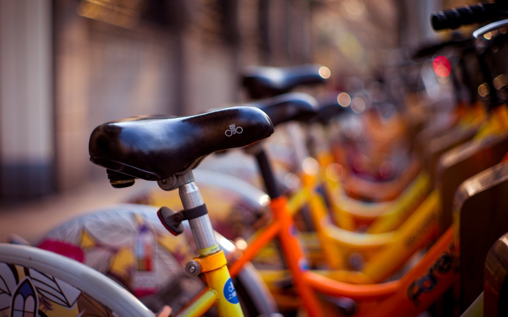 miscellaneous bike seat yellow blur bicycle background street bokeh wallpaper widescreen full screen hd wallpapers fullscreen