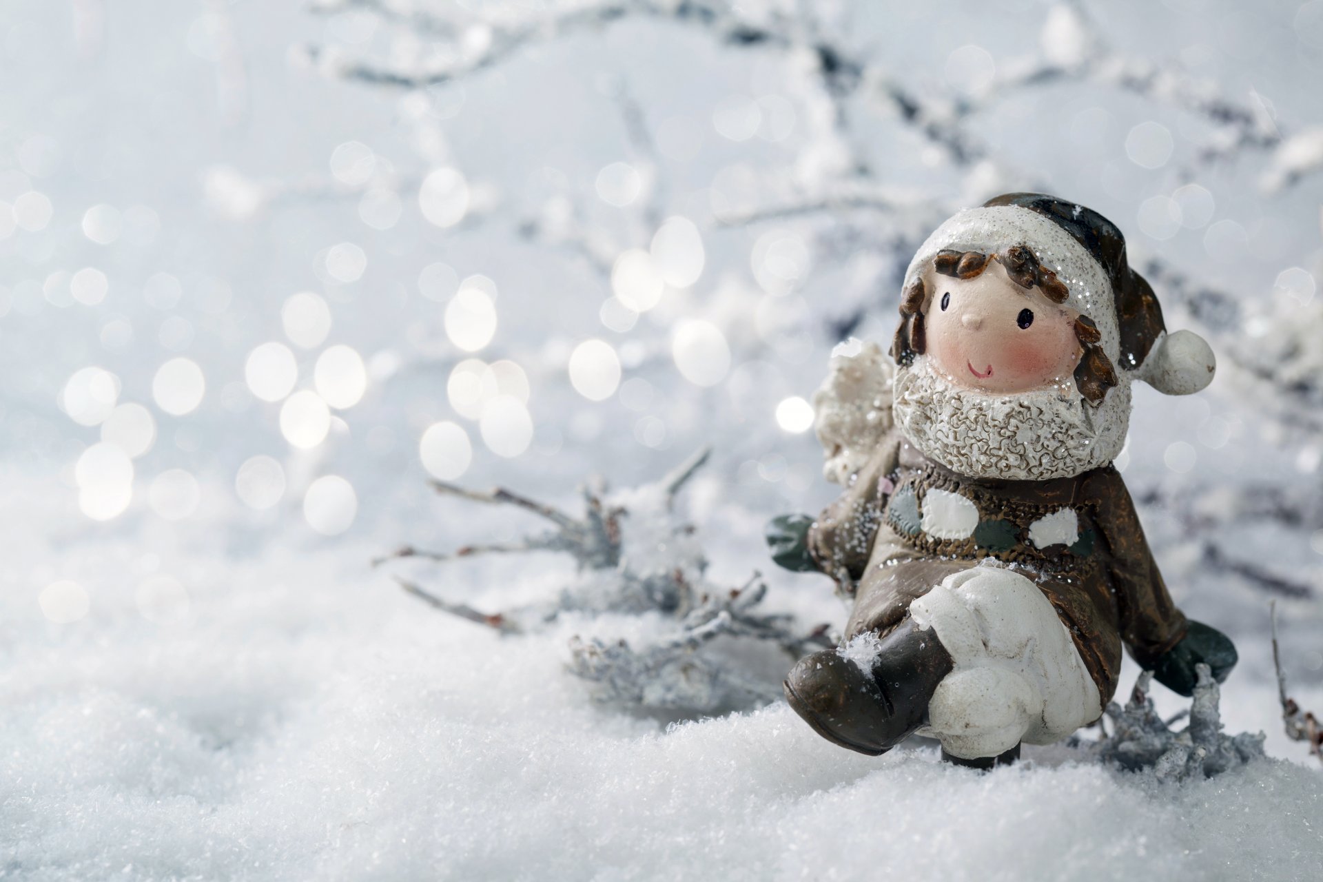 toys girl statue snow winter branches bokeh