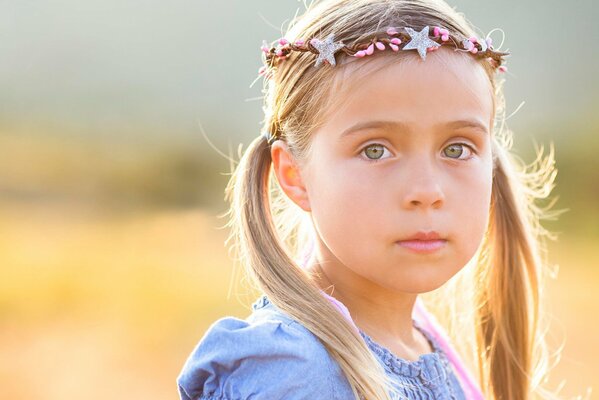 Blonde girl with ponytails and jewelry