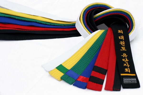 Seven multicolored belts tied in a knot