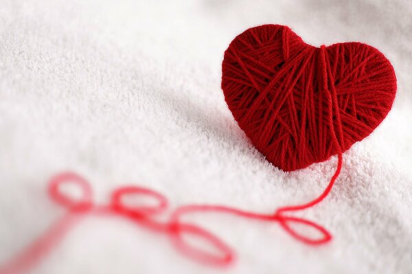 A ball of thread in the shape of a heart