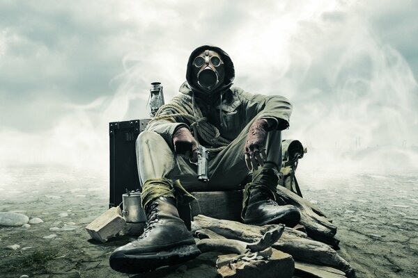 A stalker in a gas mask sitting on a rock