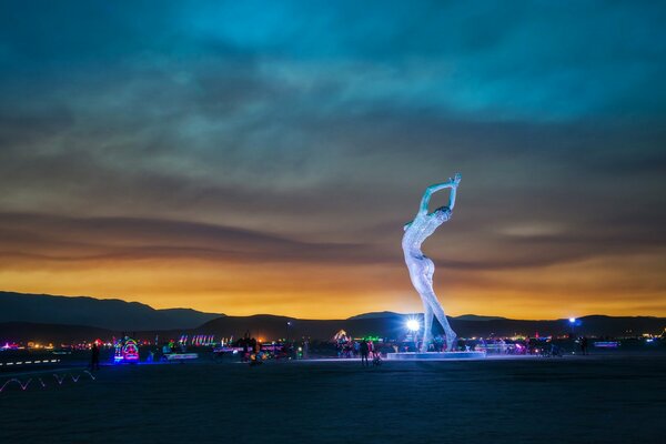 Art object of a dancing lady at sunset