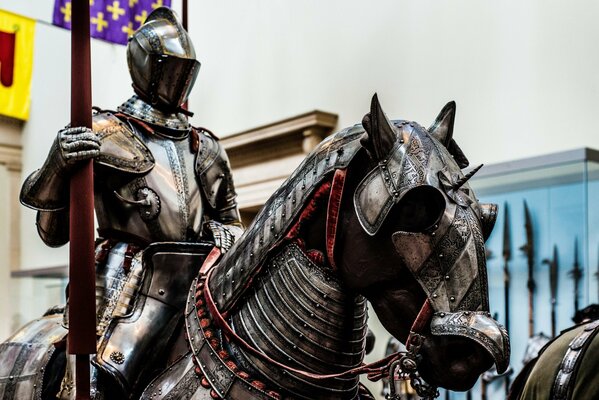 A knight in armor riding a horse