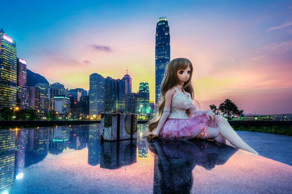The doll is sitting on the riverbank at dawn