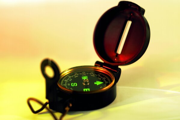 Mechanical compass with glowing letters