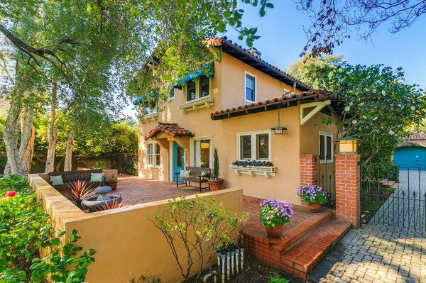 A nice house with a garden and flowers cheerful photo