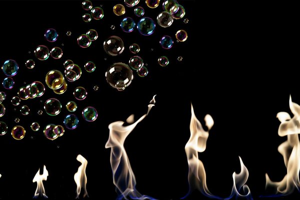 Multicolored bubbles on the background of fire