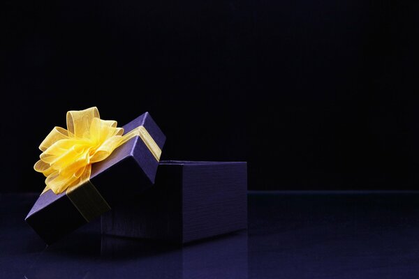 Gift box with a bow. Widescreen wallpaper