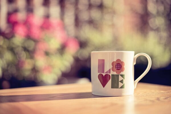 There is a cup about love on the table