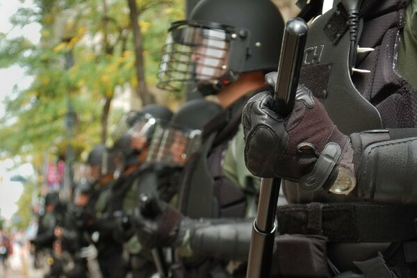 Formation of riot police ready to perform the task