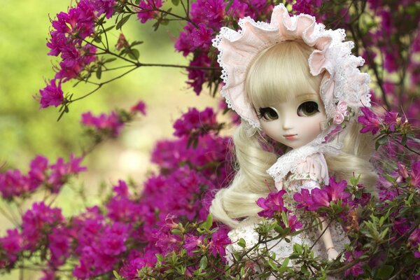 Beautiful doll in azalea flowers