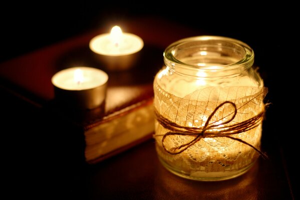 Candle background and beautifully decorated jar