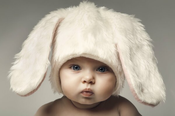 Happy baby in a rabbit costume