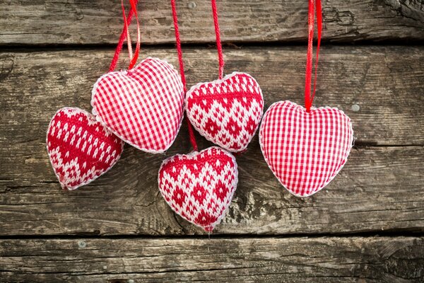 Toys knitted hearts on strings