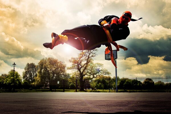 Ninja striking in flight, against the background of trees