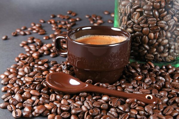 Coffee beans with cup and spoon
