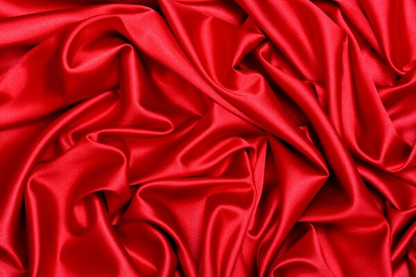 Фотография складок ткани красного цвета. Шёлк