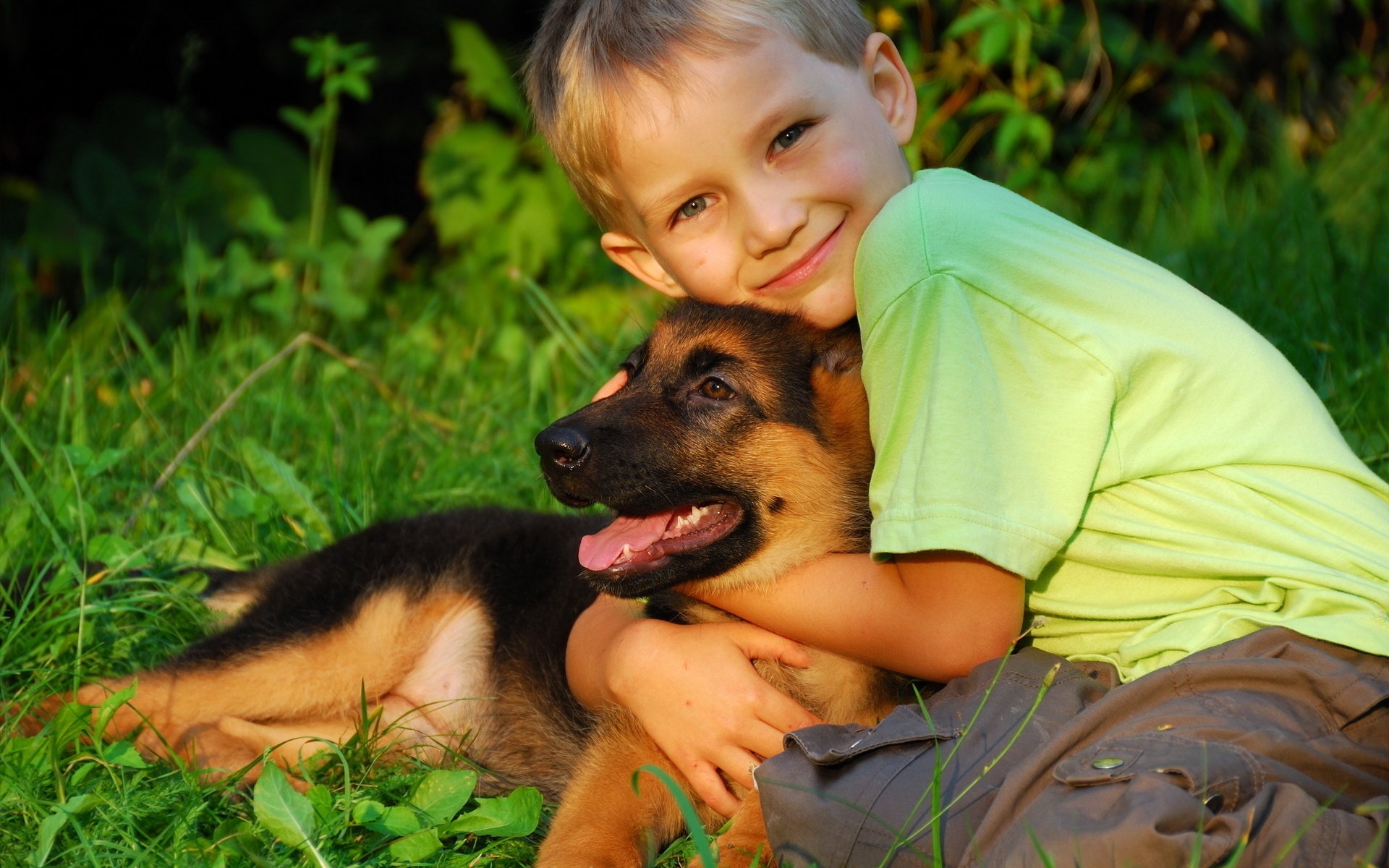 boys child dog puppy hugs other friend