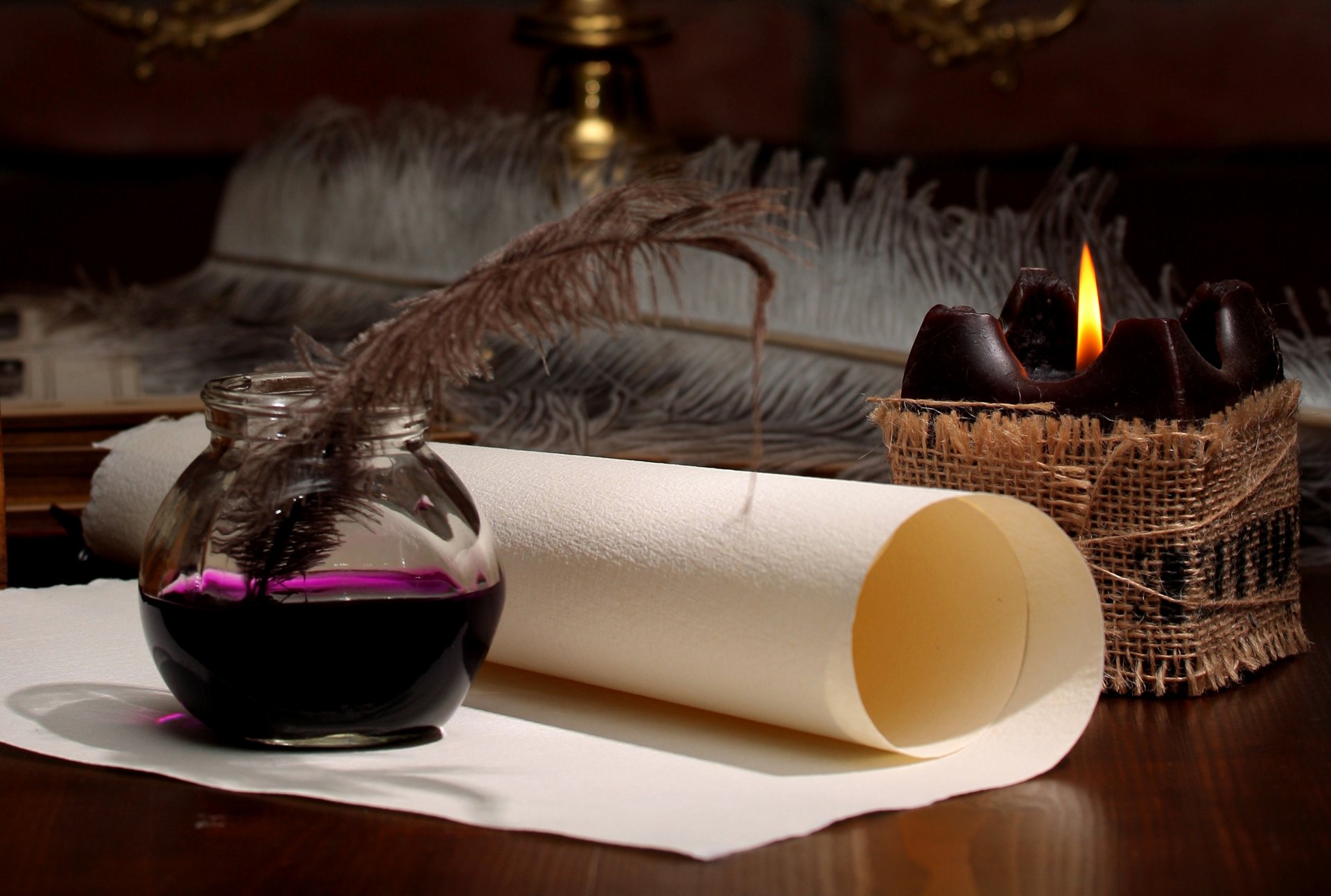 ink feather scroll paper candle