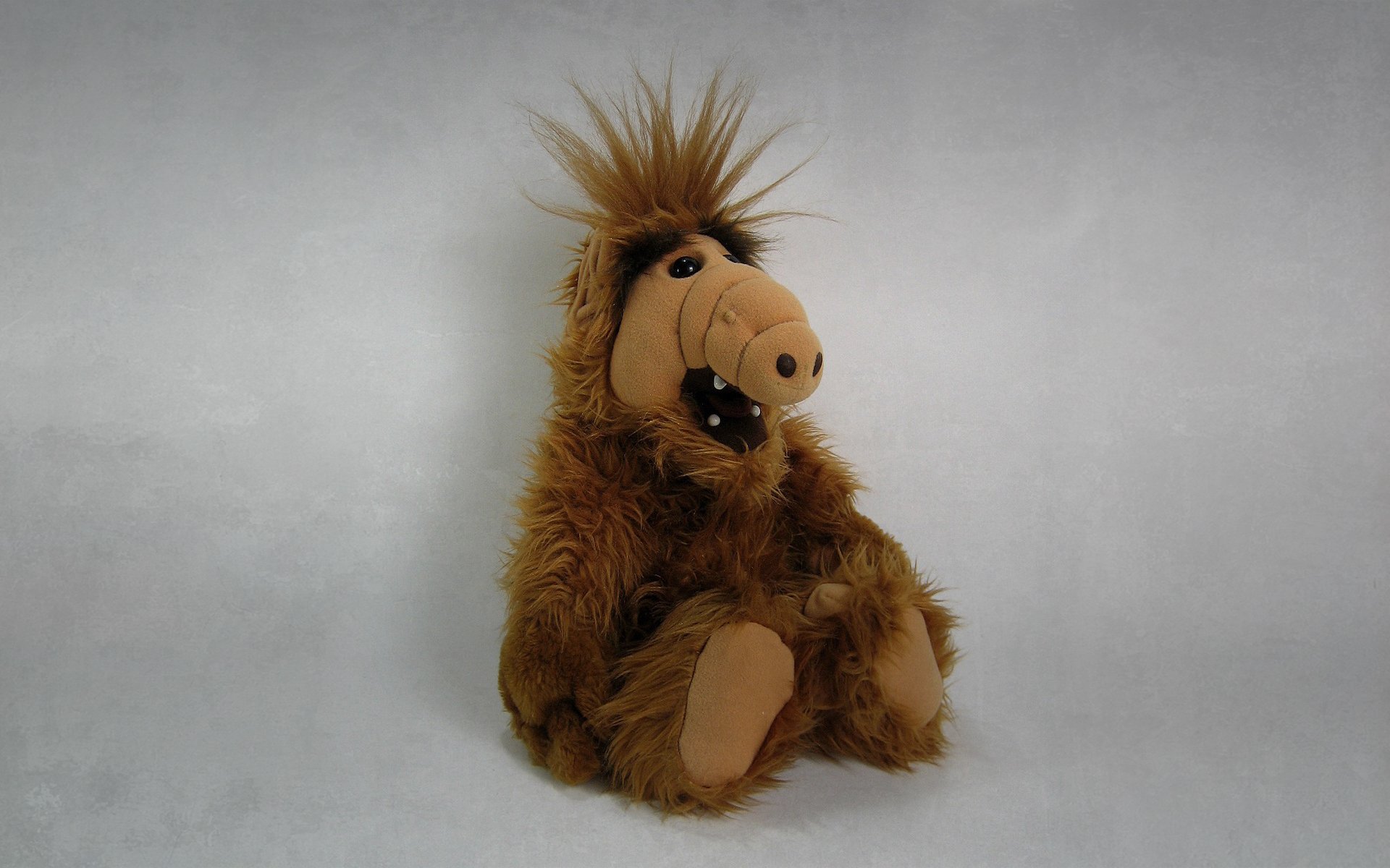 alpha alf toys sitting dark background alien stranger