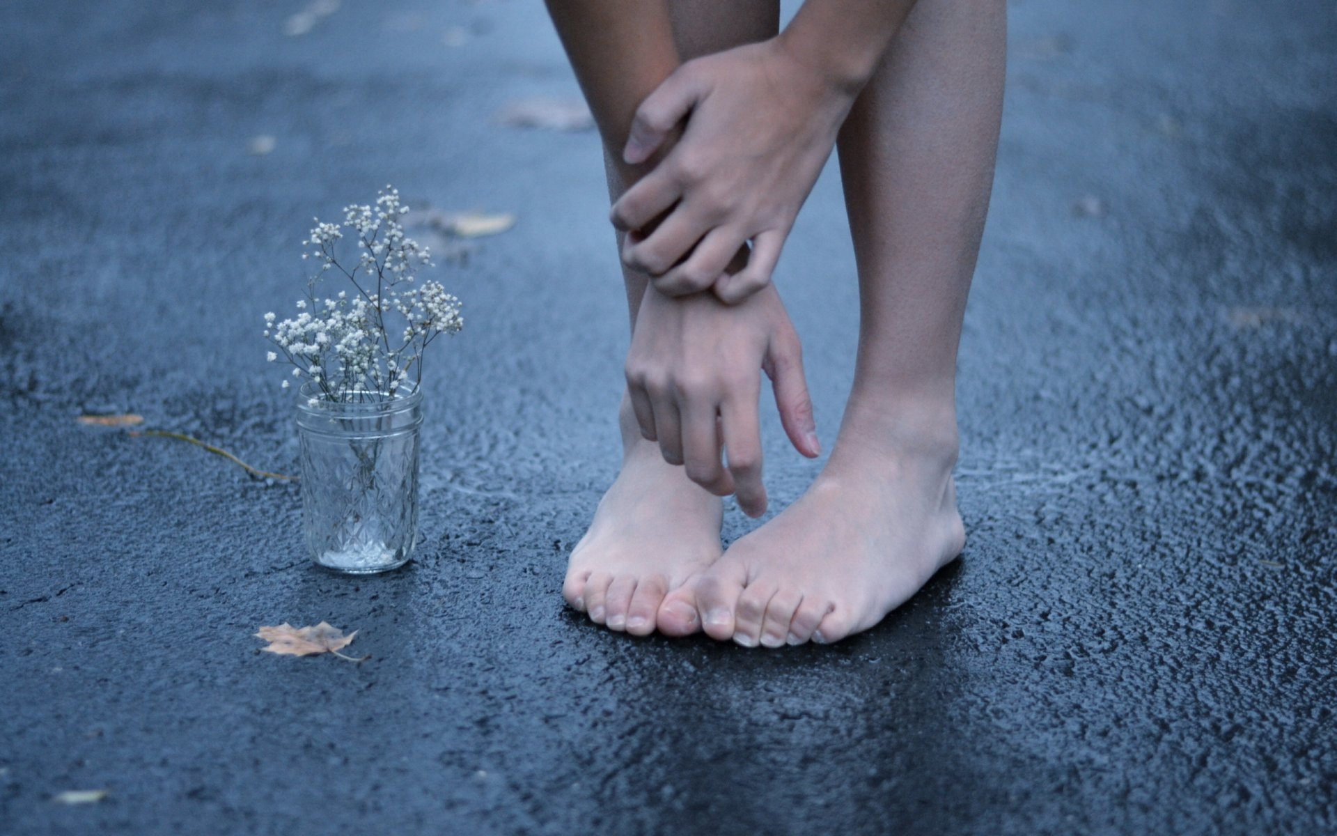 hands feet flower asphalt street