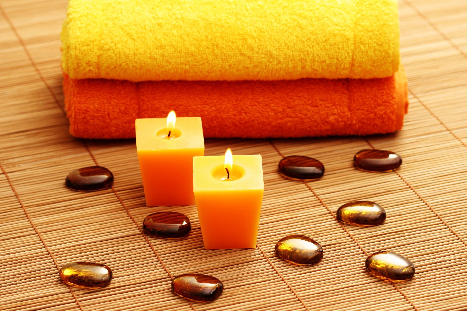 candles spa stones towels mat