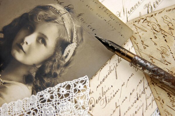 Beautiful photo of a girl with a pen on the table