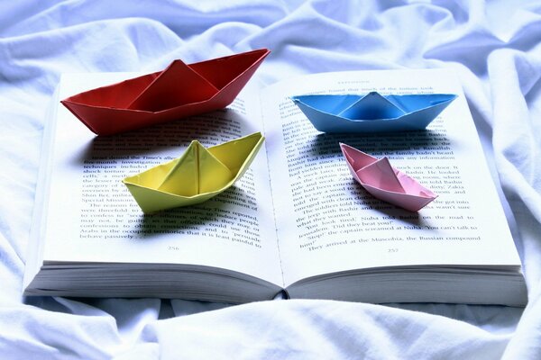 Unearthing a book on sheets with 4 paper boats