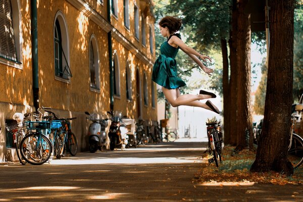 The girl jumped and took a photo in the air