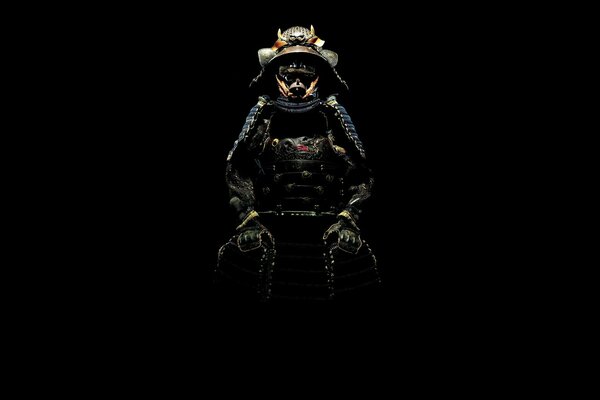 Samurai costume glowing on a black background