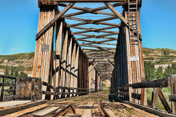 Railway bridge on the background of the mountain and the sky