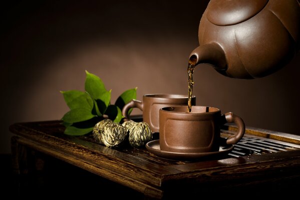 The pottery is on a wooden table