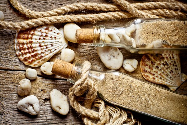 Beautiful photo of shells and bottles with sand