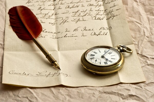 A paper with a written text on which there is a clock and a fountain pen with a red pen