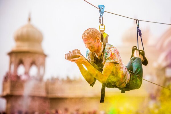 Photographer on a rope at the festival of colors