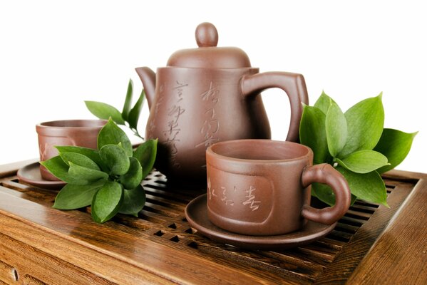 Clay teapot and cups for tea brewing