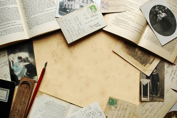 Vintage books and letters with photos on the table