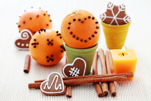 Decorated oranges with carnation and candle