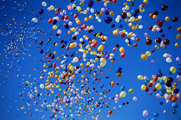 Colorful balloons fly far into the sky