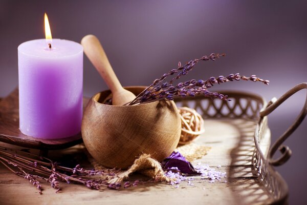 Crushed lavender with a lavender candle